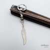 Indian agate feather earring, green gemstone and silver coloured feather on a small hoop