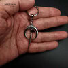 Silver moon earring with long spike and black Onyx gemstone. With large stainless steel hoop.