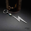 Thunderbolt earring in metal and blue impression Jasper gemstone. With small hoop