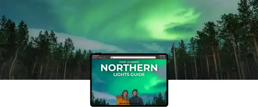 A vibrant green aurora lights up the night sky above a dense forest of tall pine trees. In the foreground, a digital interface reads “Your Ultimate Northern Lights Guide,” featuring a smiling couple dressed in winter clothing against the glowing sky.