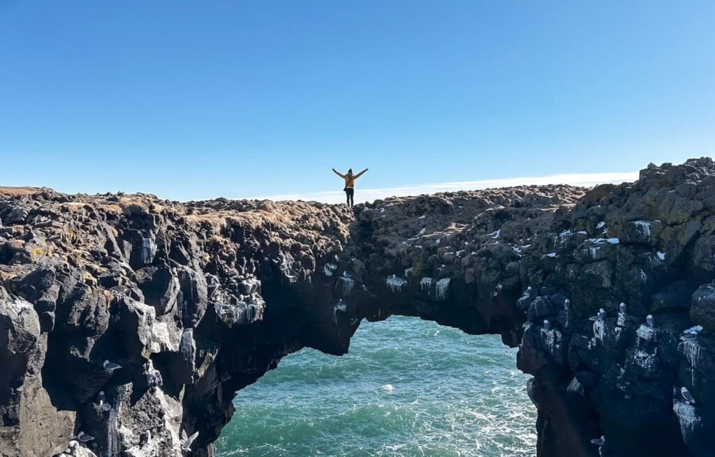Walking across Arnarstapi Land Bridge
