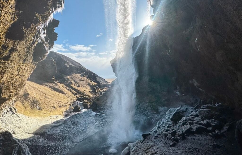Underneath Kvernufoss waterfall