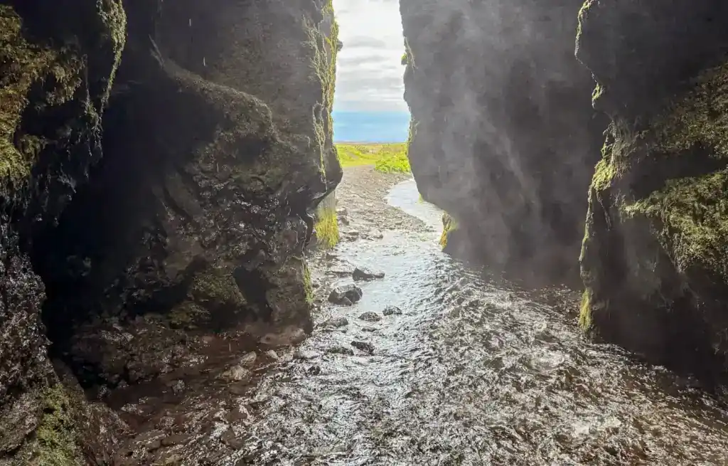 Inside the cave at Gljufrabui Waterfall