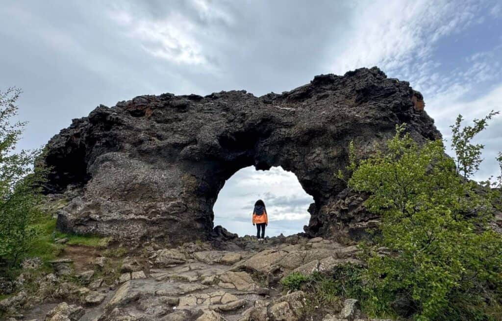 Standing in one of the archways in Dimmuborgir Lava Field
