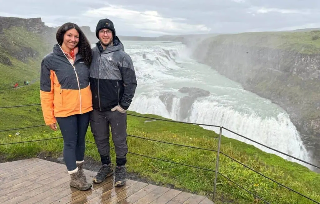 Us standing next to Gullfoss on a rainy day in summer