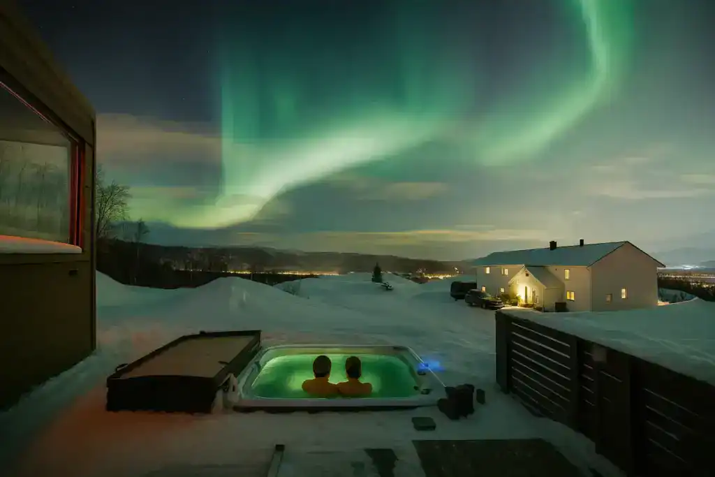 The Aurora Borealis Resort near Tromso and the Northern Lights over it
