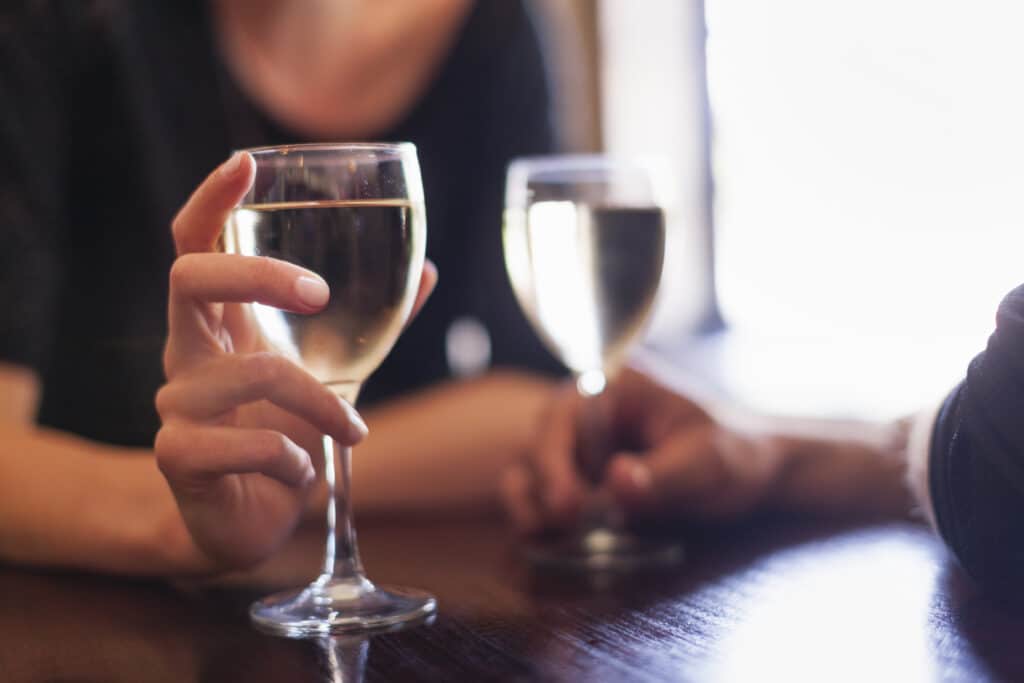 Pennsylvania Wines 2 Two People, A Couple Sitting In A Bar Having A Glass Of Chilled White Wine.