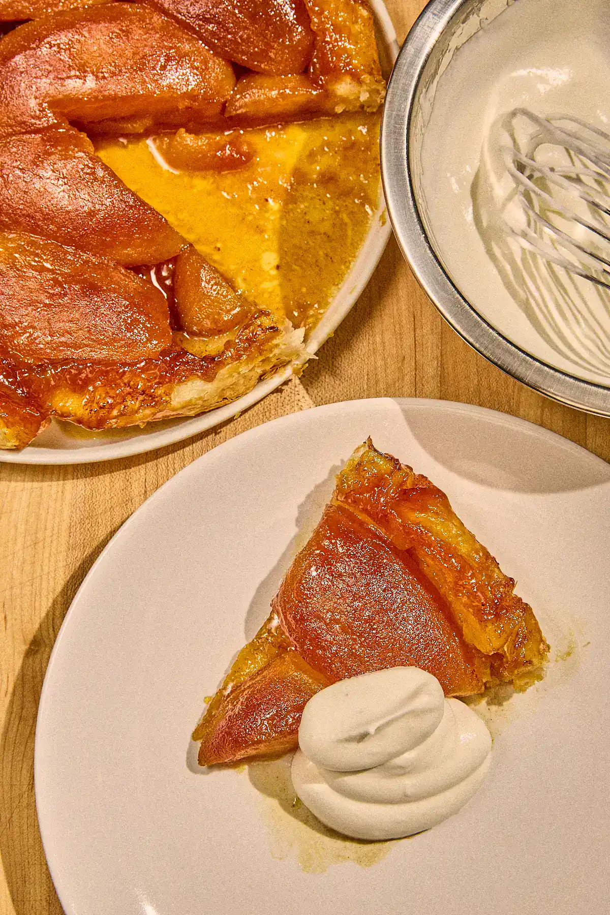 apple tarte tatin slice with whipped cream