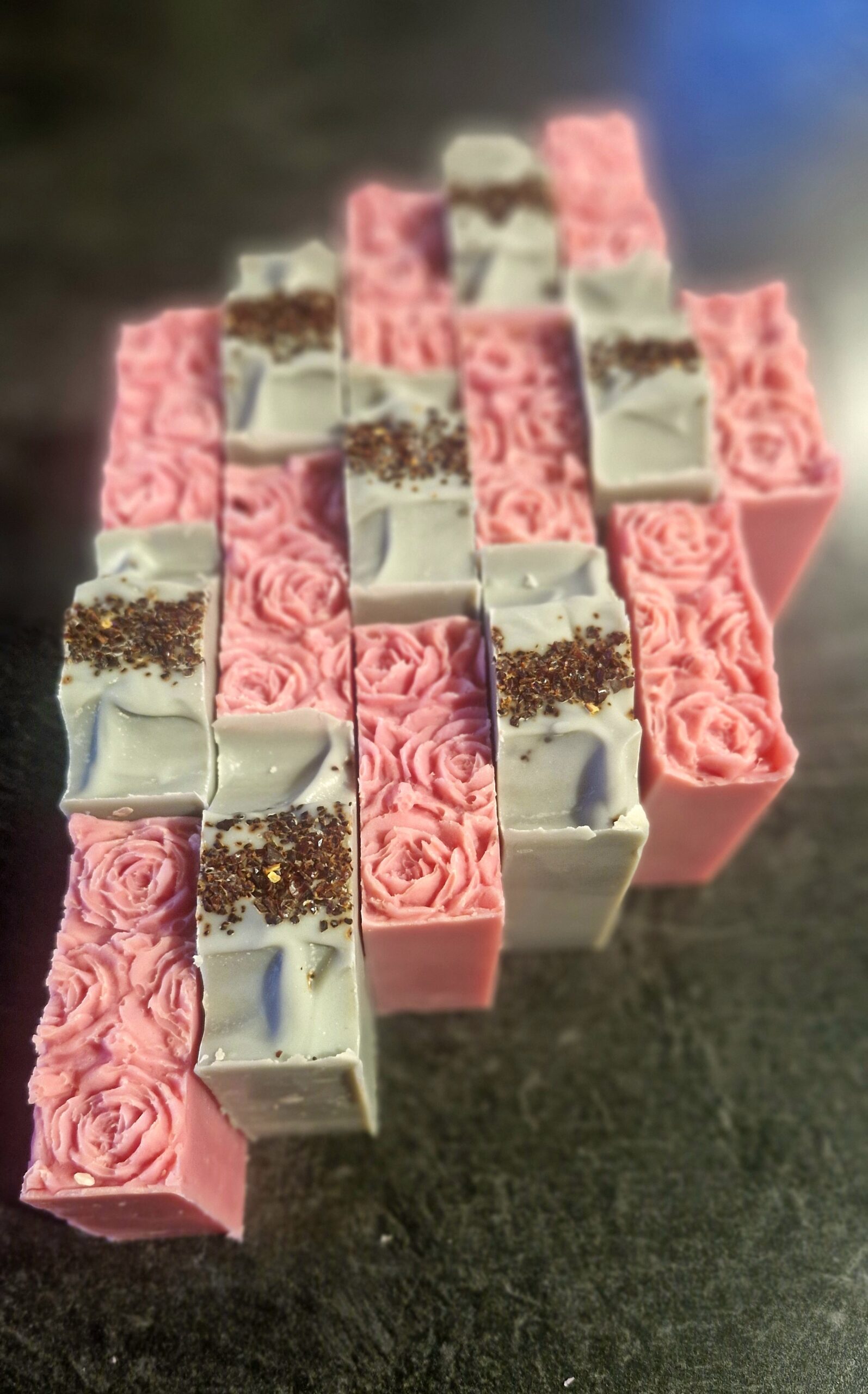 Handmade rose-scented tallow soap bars with a rose-molded top, coral moss, and activated charcoal, Fatglow soap art