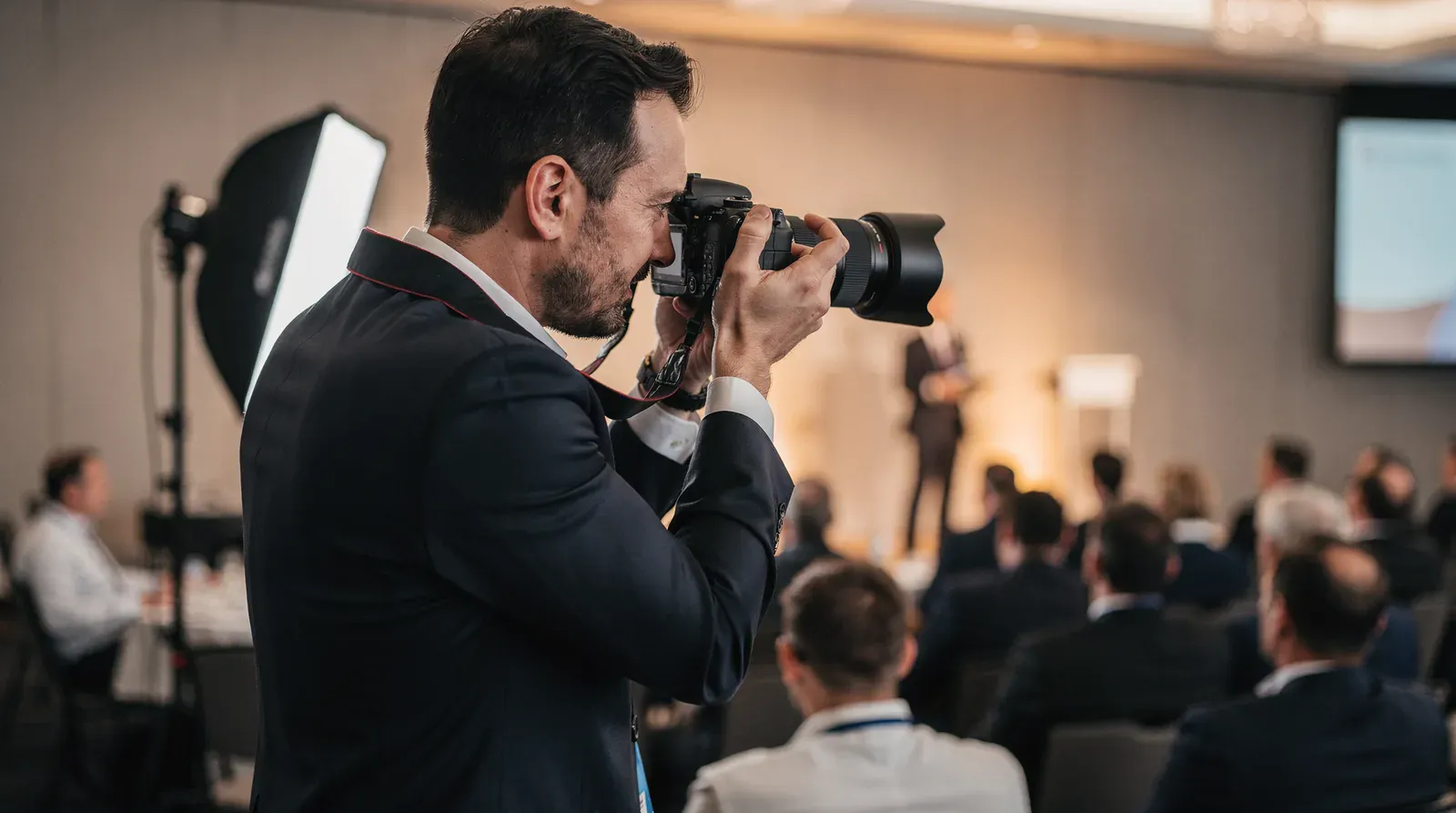 Corporate event photography with on-site printing creates a visual first impression that helps guests envision