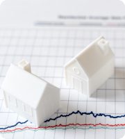 white toy house on graph paper