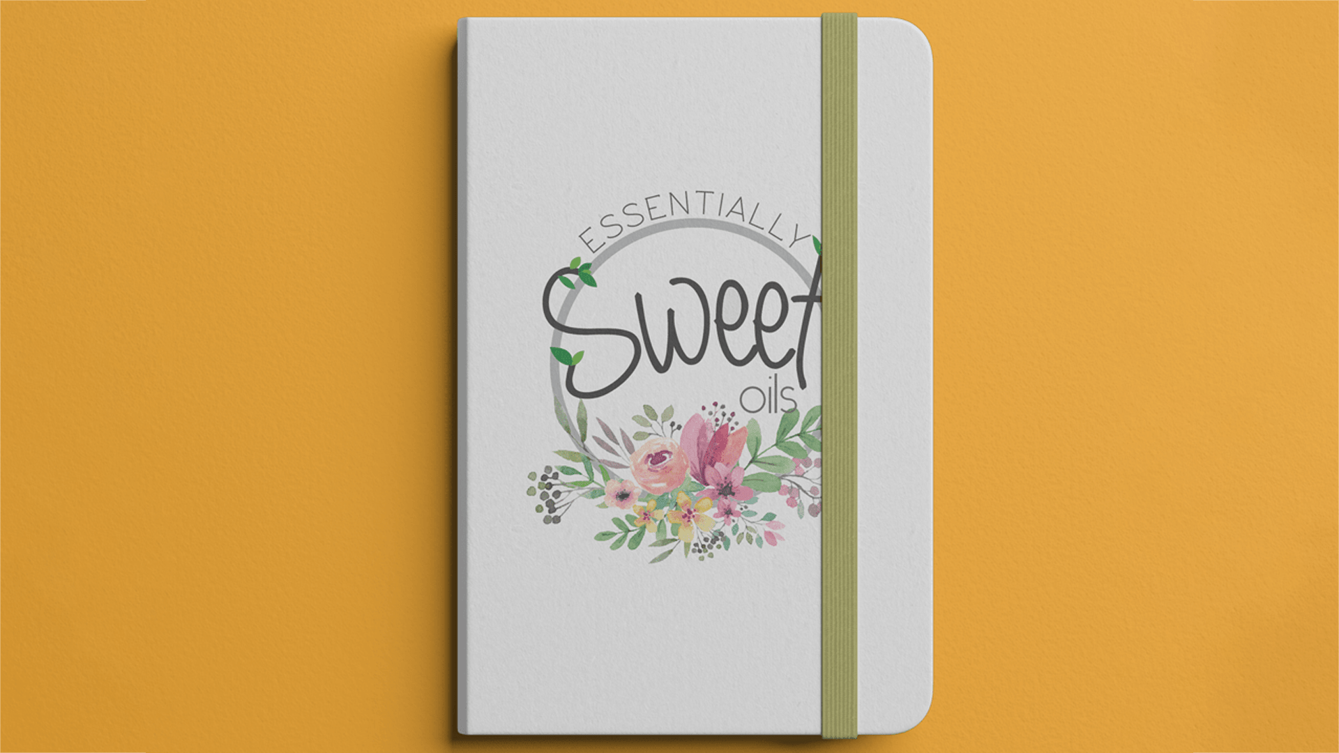 Logo & Brand development for 'Essentially Sweet' Oils notebook mockup