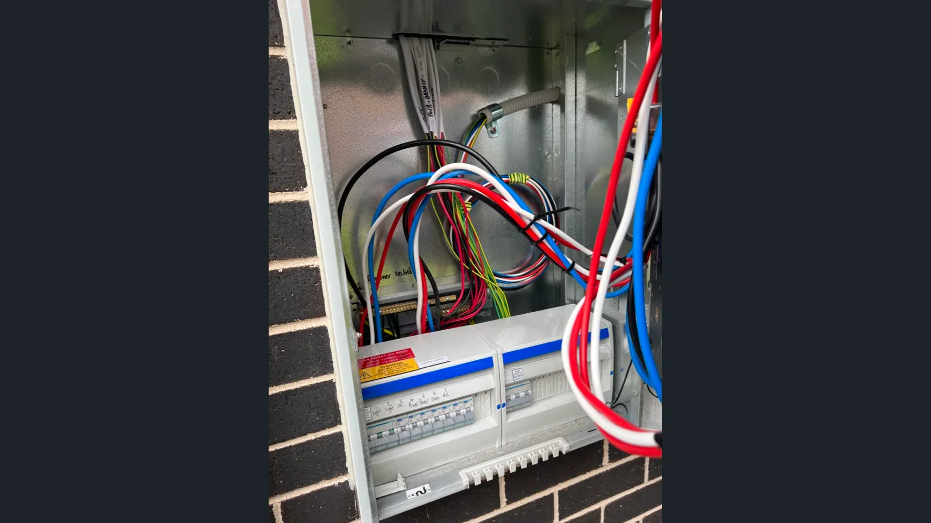 Electrician inspecting a Sydney home's meter box before purchase.