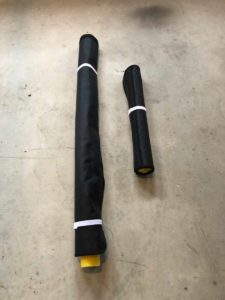 Shades stored rolled up on pool noodles