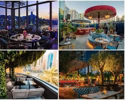 تراس خارجي لمطعم في دبي مارينا يطل على اليخوت وناطحات السحاب.