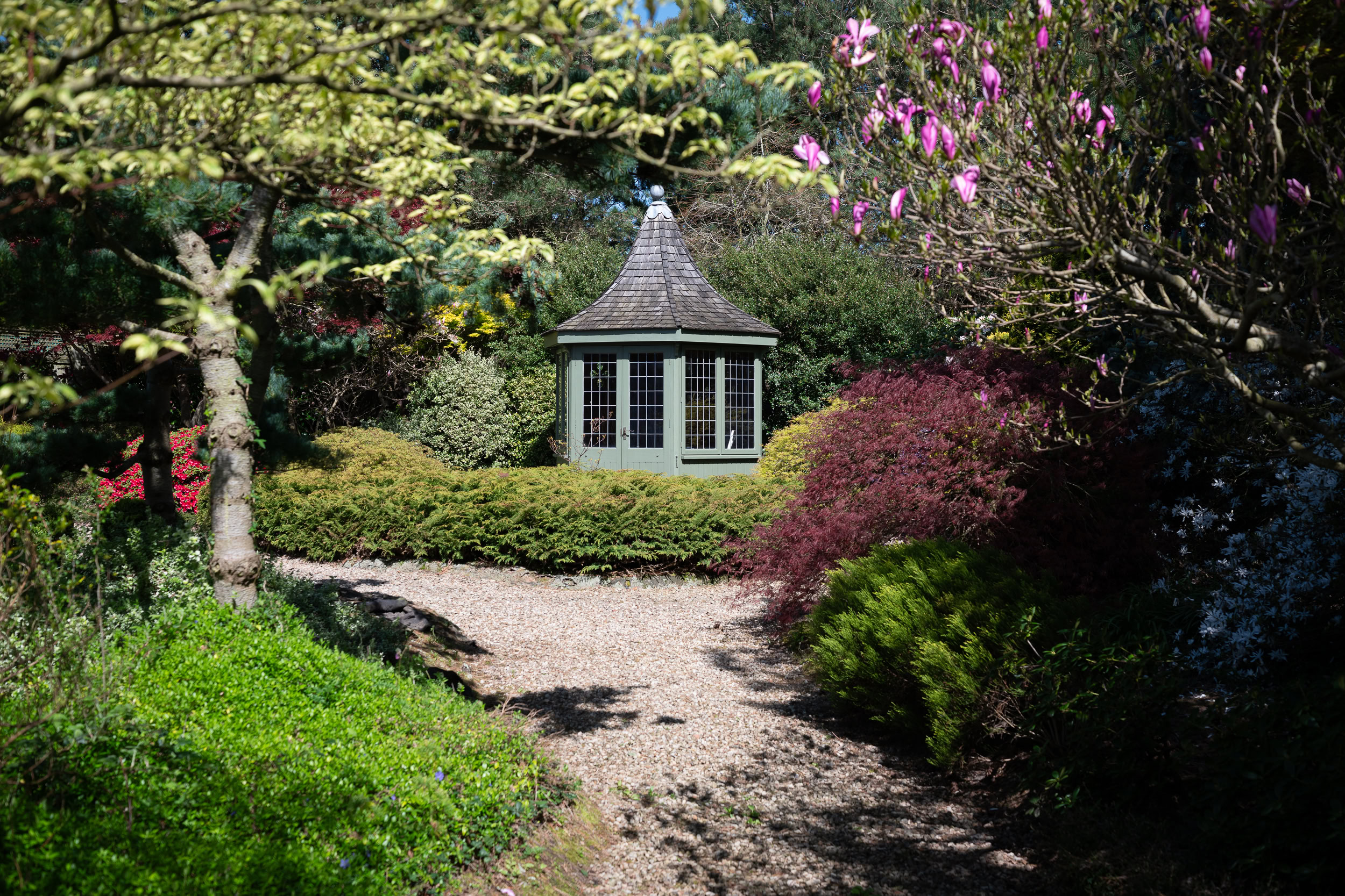 Landscaped Japanese-style garden surrounding a residential property
