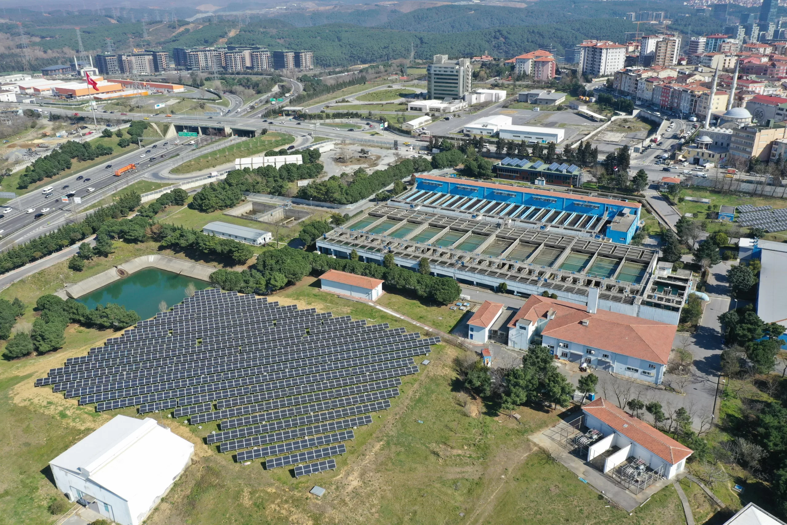 A futuristic cityscape with solar panels, wind turbines, and smart infrastructure showcasing sustainable innovation