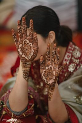 muslim bride wearing mehendi and traditional attire