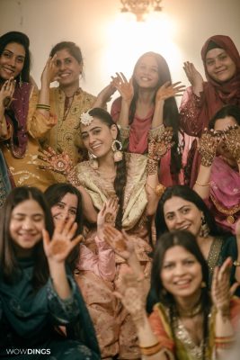 Muslim bride's with bridesmaid during a mehendi ceremony