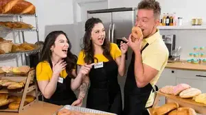 Two pretty girls work in a bakery and are never alien to the delights of an office romance