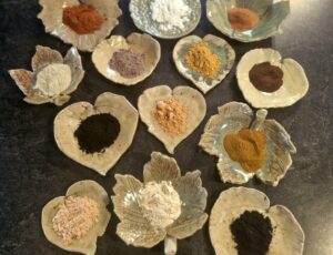 Clays and Botanicals displayed in handmade pottery soap dishes - Fatglow NZ