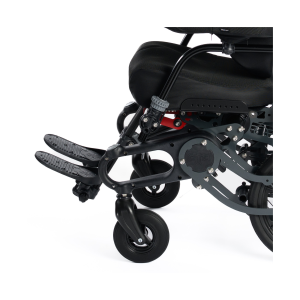 Side view close-up of wheelchair footplates supporting feet for correct lower limb positioning