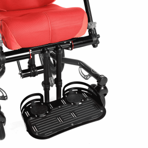 Footbox accessory on a wheelchair shown in the lowered position