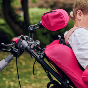 Lifestyle image of a wheelchair user using a supportive back cushion for posture and comfort