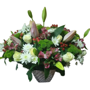 One In A Million flower arrangement with lilies, chrysanthemums, white roses, alstroemeria, and red berries in a glass vase – same-day flower delivery Nairobi.