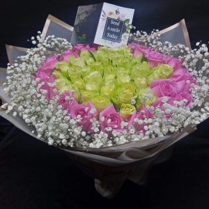 Perfection In Pink bouquet with pink and white roses and baby’s breath