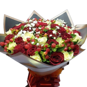 Romantic flower arrangement with red roses, white roses, hypericum berries, and baby's breath