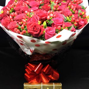 Water Bouquet Special with 30+ red roses, hypericum berries, Ferrero Rocher chocolates, red bow, luxury bouquet for same-day flower delivery Nairobi