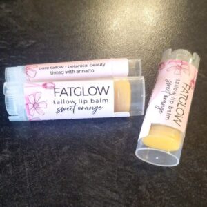 Fatglow Sweet Orange and Annatto infused grass-fed tallow lip balm — a natural botanical lip treatment handmade in New Zealand