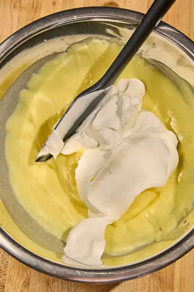 folding whipped cream into pudding