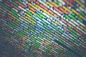 Colorful lines of computer code arranged in rows.