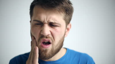 stock-footage-portrait-of-a-man-experiencing-toothache-close-up