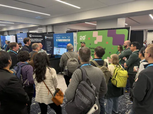 Photo showing Web Chefs giving a demo at our booth at Drupalcon Chicago