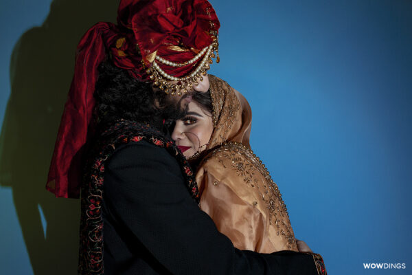 Groom hugging beautiful bride at a muslim wedding in delhi