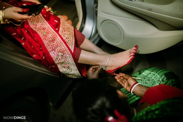 Bride wearing Alta on her leg, Cross culture wedding photography in kolkata by wowdings