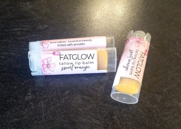 Fatglow Sweet Orange and Annatto infused grass-fed tallow lip balm — a natural botanical lip treatment handmade in New Zealand