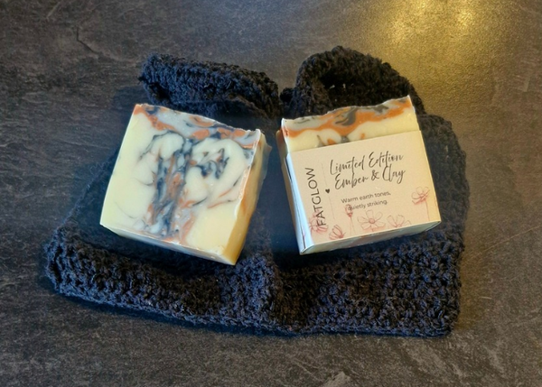 handcrafted grass-fed tallow soap, showing a striking swirl of cream, rose clay, red clay, blue indigo and activated charcoal, limited edition by Fatglow Taranaki New Zealand
