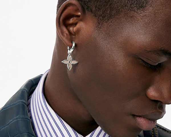 Man modelling a Louis Vuitton silver earring