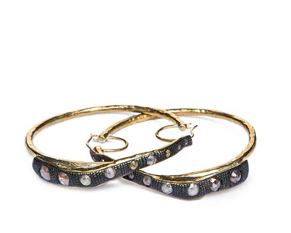 Photo of pair of earrings by Ricky Owens in bronze and diamonds