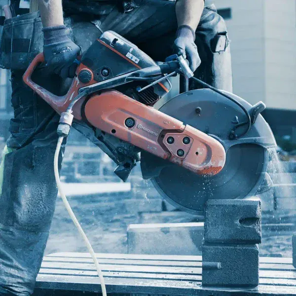 K770 14" POWER CUTTER being used to cut bars of iron/metal.
