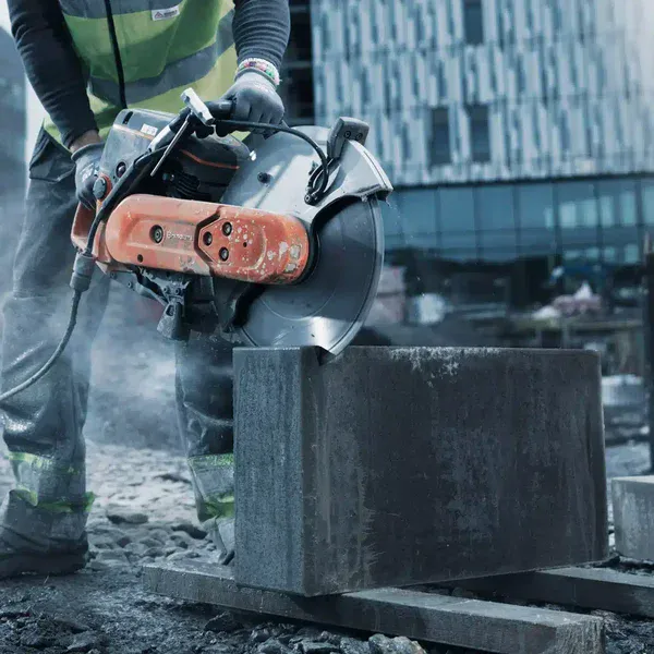 K770 14" POWER CUTTER being used to cut a block of metal