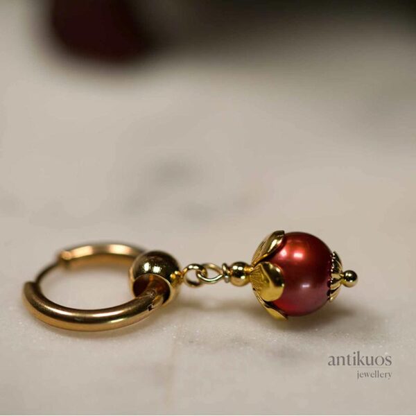 Copper, a pearl earring