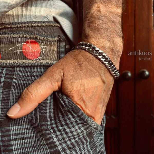 Man wearing a silver chain bracelet