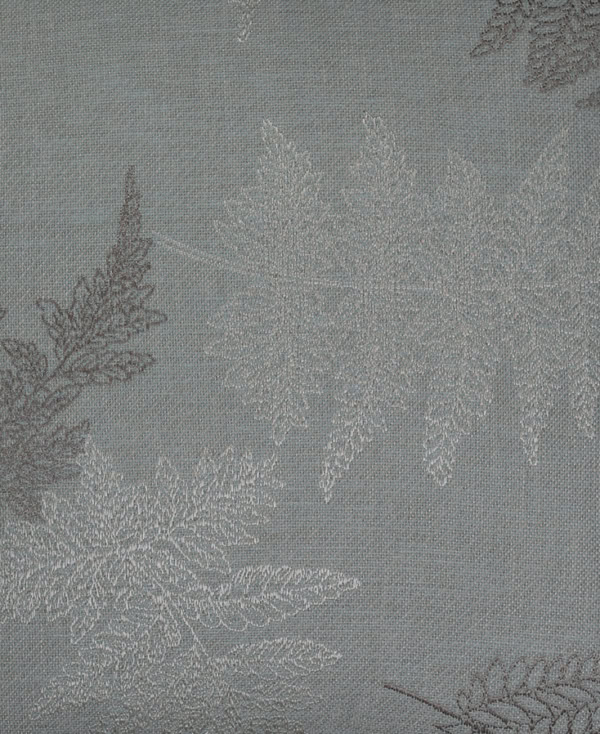 close-up view of Grey silk cushion cover with woven leaf patterns from Mulberry Home India