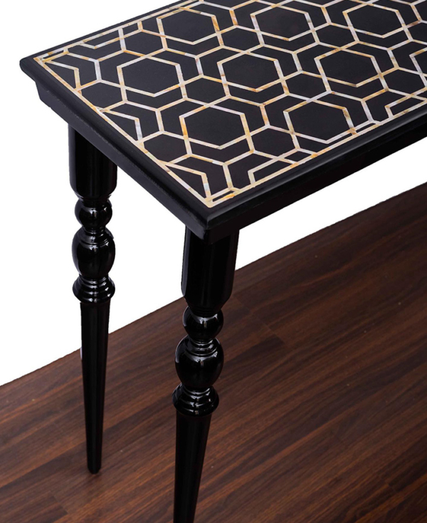 right angled view of a wooden console table with black mother of pearl inlaid top from Mulberry Home India