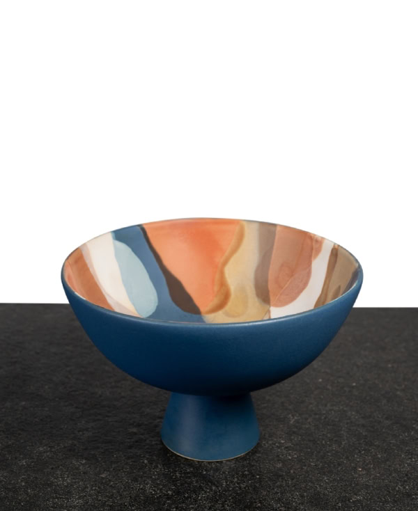 Handcrafted blue ceramic bowl with a bold pedestal design and multicolor glaze in the inside from Mulberry Home India